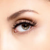 Open eye close up woman wearing Mandee 3D fiber lashes