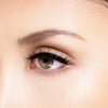 Side view of woman wearing Mila wispy eyelashes